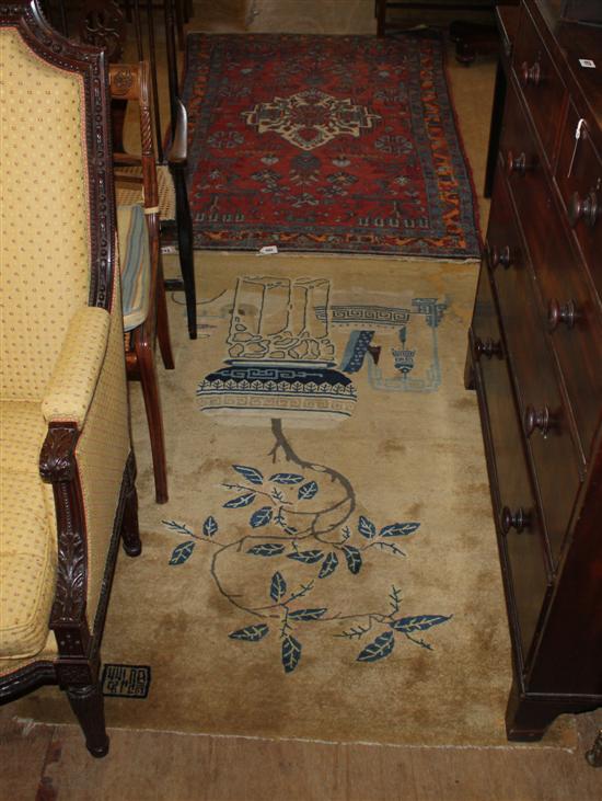 Persian red ground rug and a Chinese camel ground rug